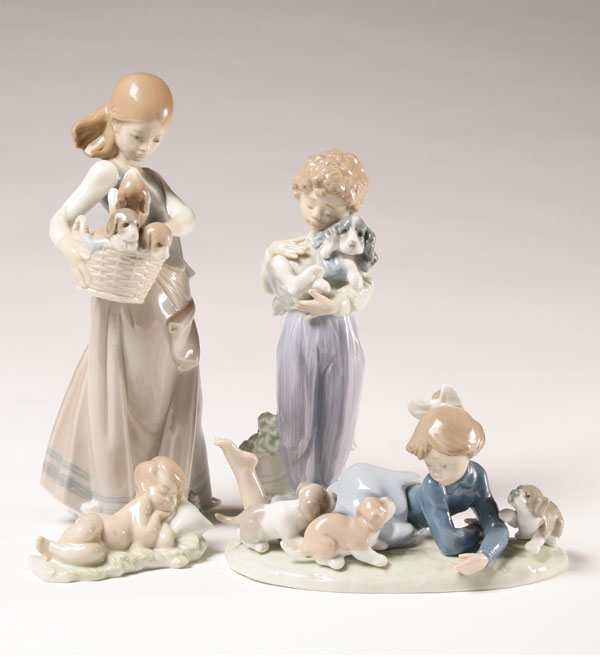 Appraisal: Lladro sleeping infant boy with puppy girl with puppies and