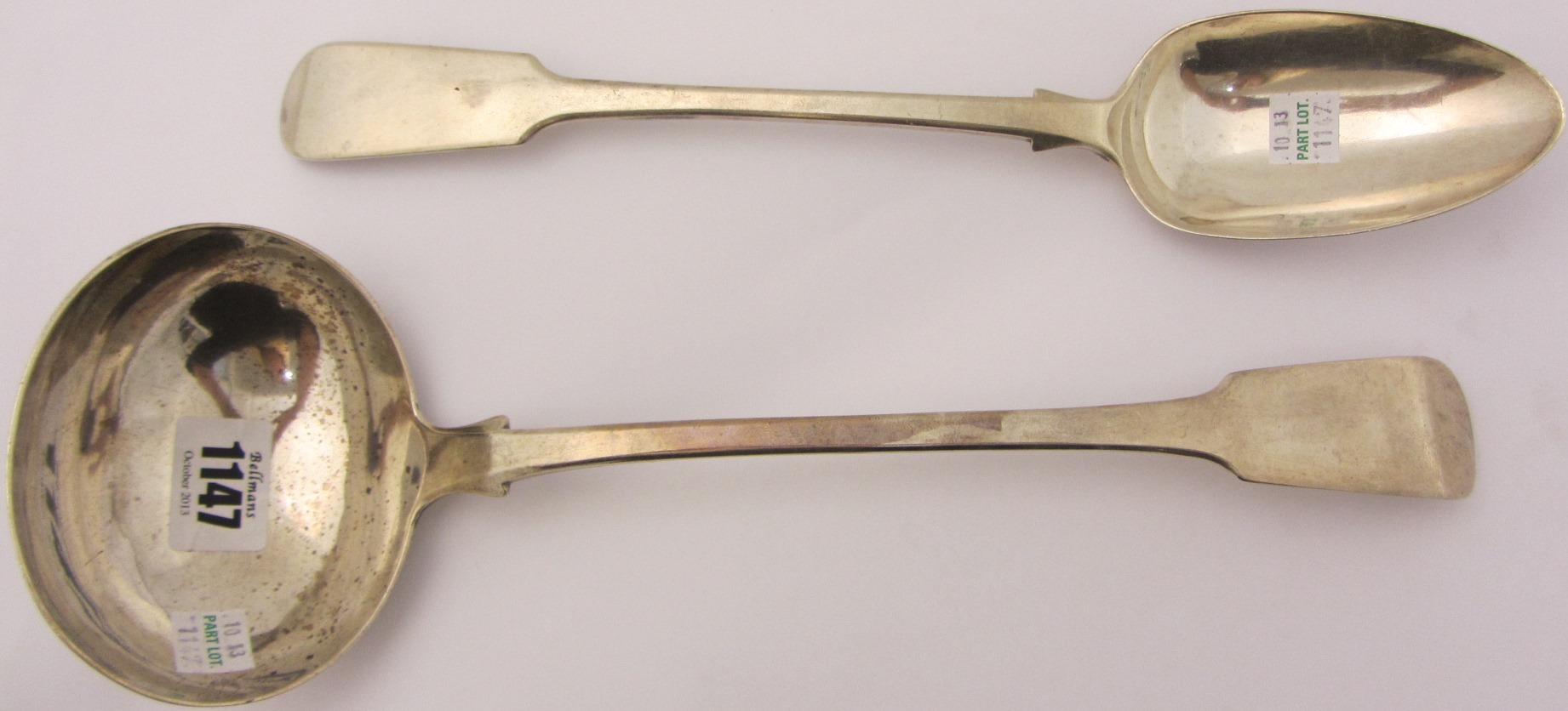 Appraisal: A silver fiddle pattern soup ladle London and a silver