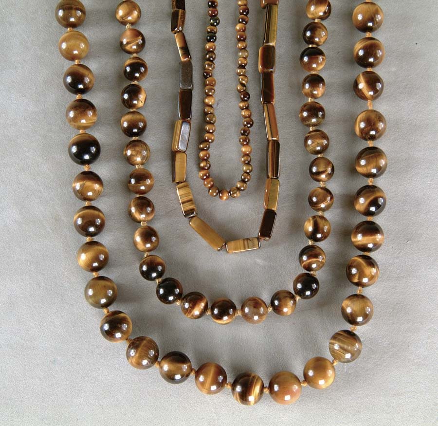 Appraisal: FOUR TIGER EYE NECKLACES Lot consists of four tiger eye