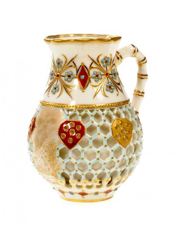 Appraisal: A ROYAL WORCESTER HONEYCOMB-RETICULATED JUG double walled with bamboo handle