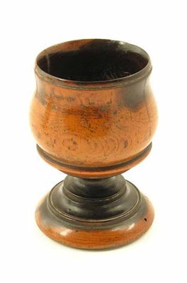 Appraisal: An th century turned laburnum goblet raised on a spreading