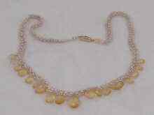 Appraisal: A seed pearl necklace with citrine drops and carat gold