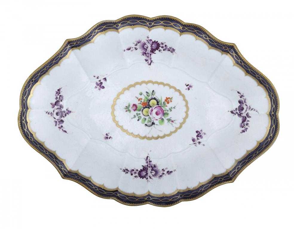 Appraisal: A WORCESTER FLUTED DESSERT DISH painted in polychrome and purple