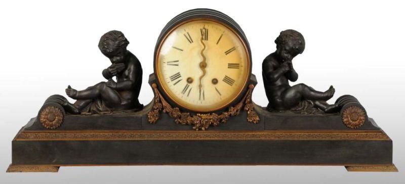 Appraisal: Antique Metal Mantel Time Strike Clock Description Decorated with cherubs