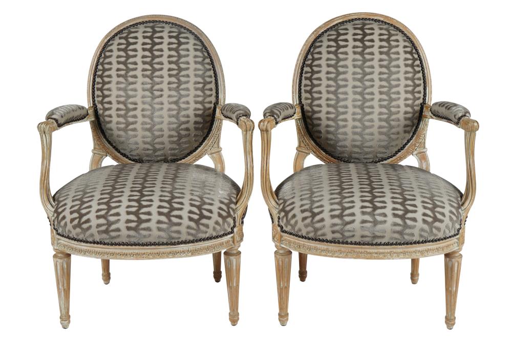 Appraisal: PAIR OF LOUIS XVI STYLE BLEACHED WOOD UPHOLSTERED FAUTEUILSCondition upholstery