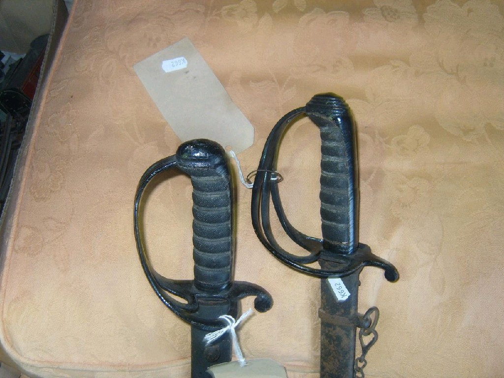 Appraisal: Two th century Light Calvary officers swords and scabbards