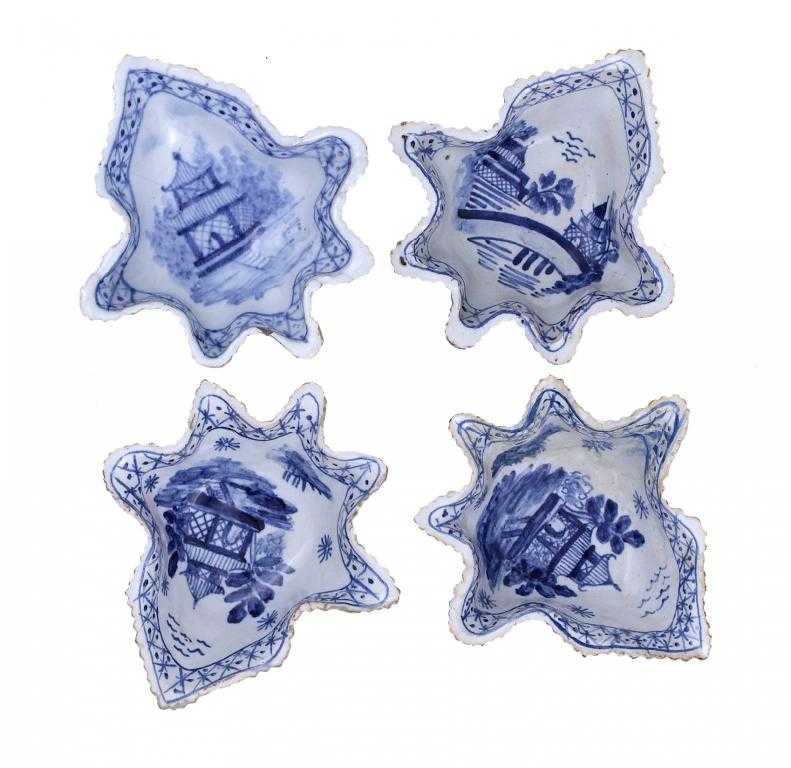 Appraisal: FOUR RARE DUTCH DELFTWARE LEAF SHAPED PICKLE DISHES painted in