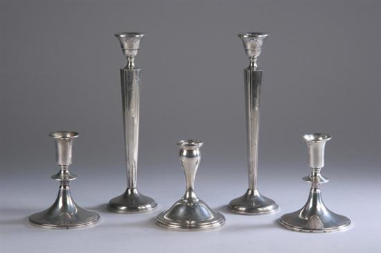 Appraisal: FIVE AMERICAN STERLING SILVER WEIGHTED CANDLESTICKS Pair tall Otto Reichardt