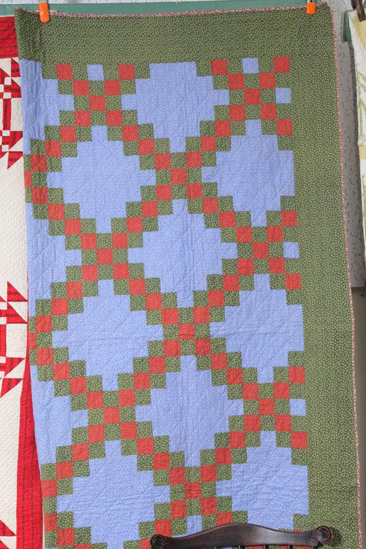 Appraisal: PIECED QUILT Comprised of red and green squares on a