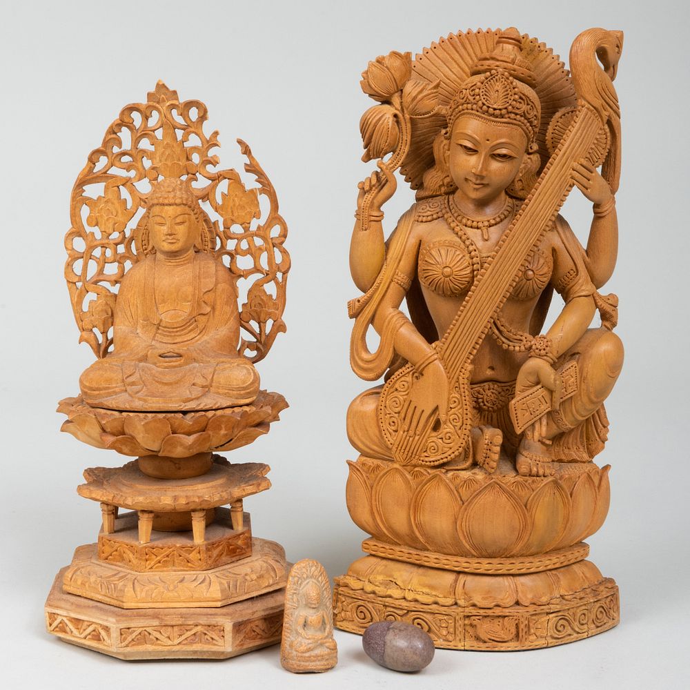 Appraisal: Indian Wood Figure of Sarasvati and a Seated Figure of