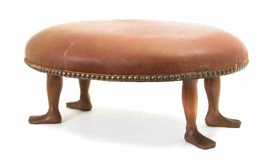 Appraisal: An American Carved Walnut Footstool having oval leather upholstered seat