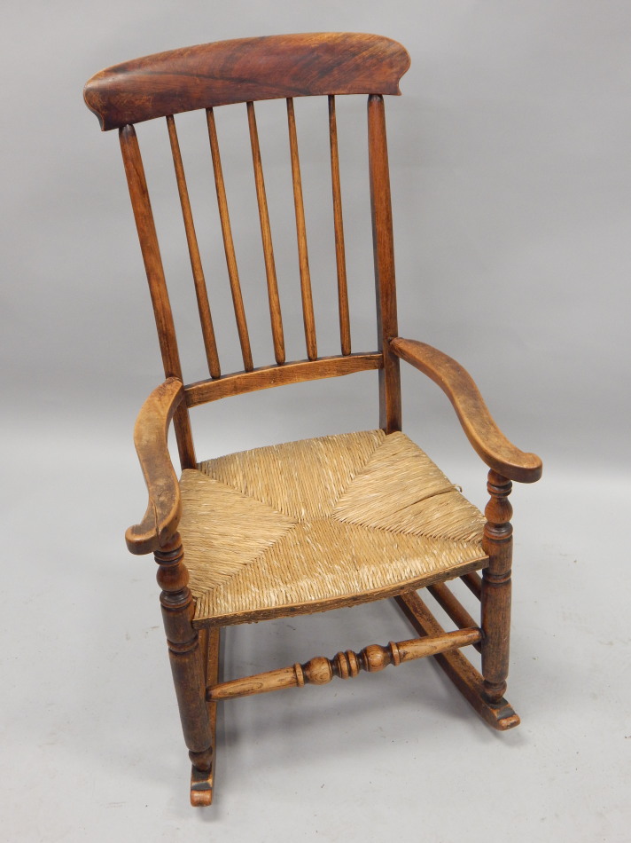 Appraisal: A thC country made rocking chair painted to simulate rosewood