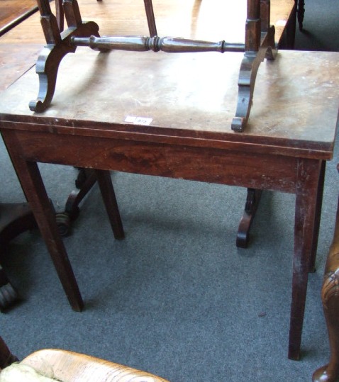 Appraisal: A George III fold over tea table the rectangular top