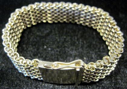 Appraisal: and karat karat yellow gold woven bracelet Featuring safety chain