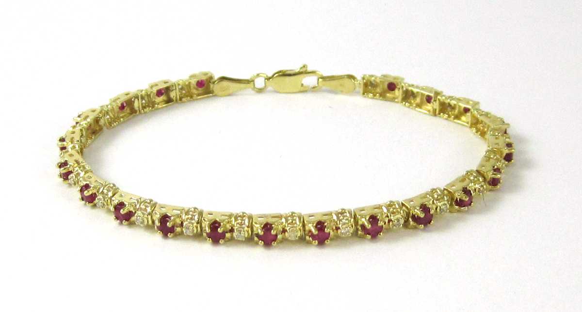 Appraisal: RUBY DIAMOND AND TEN KARAT YELLOW GOLD LINE BRACELET set