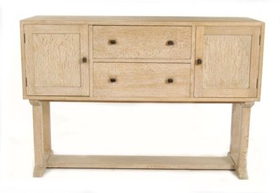 Appraisal: A Heal's limed oak dining suite comprising sideboard dining table