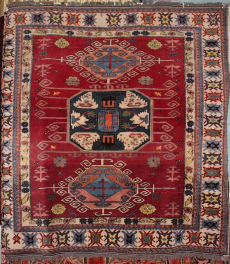 Appraisal: AFGHAN KAZAK RUG in red blue yellow green cream peach