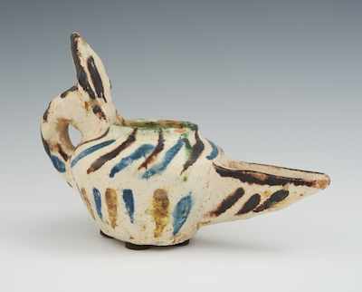 Appraisal: A Persian Polychrome Glazed Pottery Oil Lamp Of bowl shape