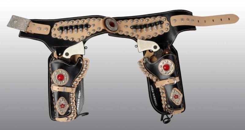 Appraisal: Lone Ranger Double Holster Gun Set Description Killer set from