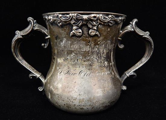 Appraisal: STERLING SILVER Loving cup with flanking shaped scroll handles bow