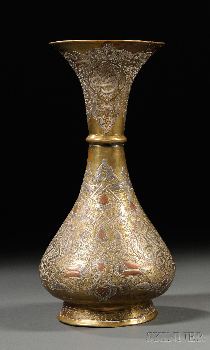 Appraisal: Mixed-metal Vase Middle East th century bottle shape resting on