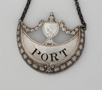 Appraisal: A middle period Old Sheffield plated 'PORT' label with an