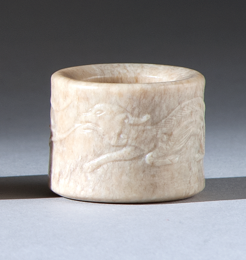 Appraisal: MUTTONFAT JADE SCHOLAR'S RING th CenturyWith relief-carved qilin and goat