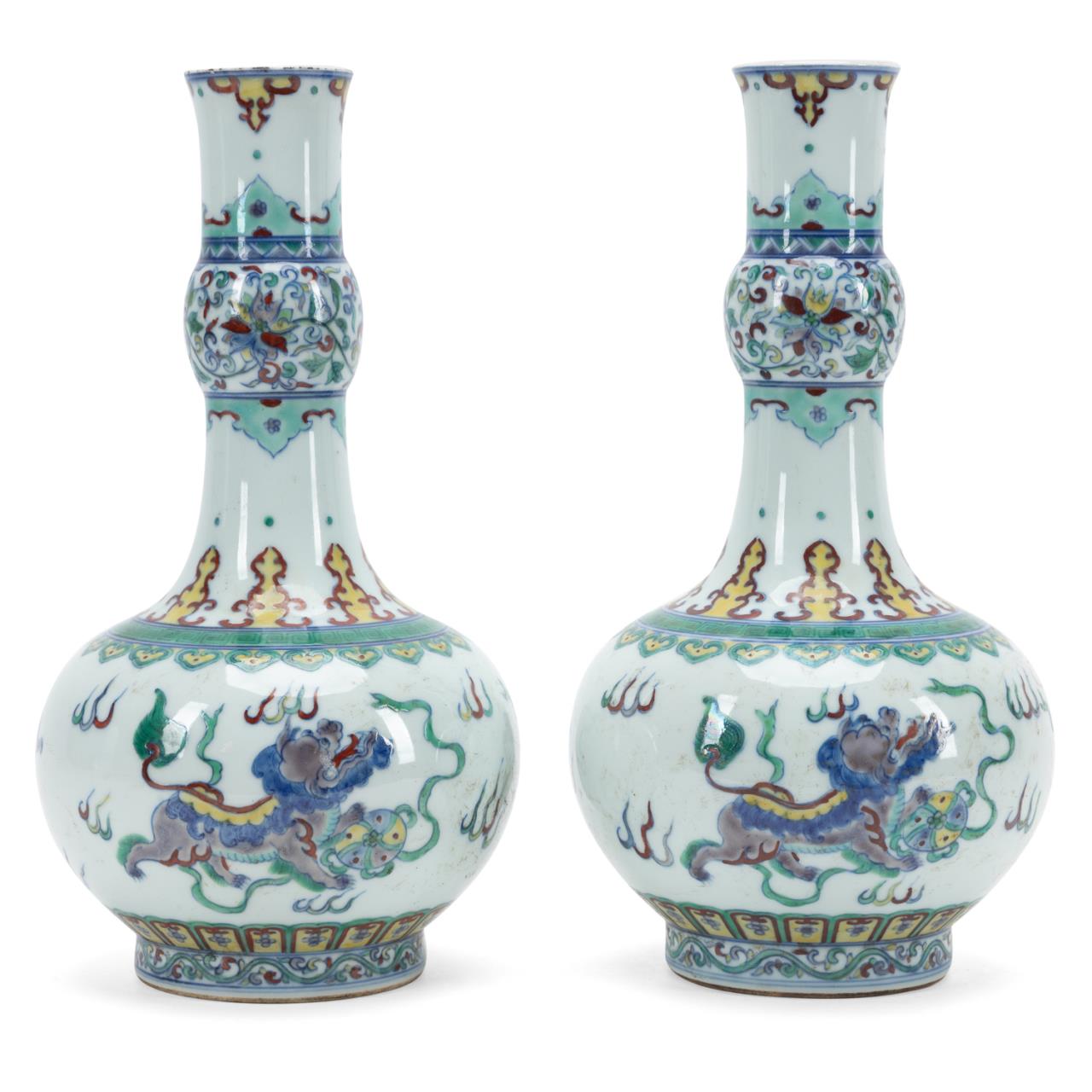 Appraisal: PAIR OF CHINESE DOUCAI VASES WITH GUARDIAN LIONS Pair of