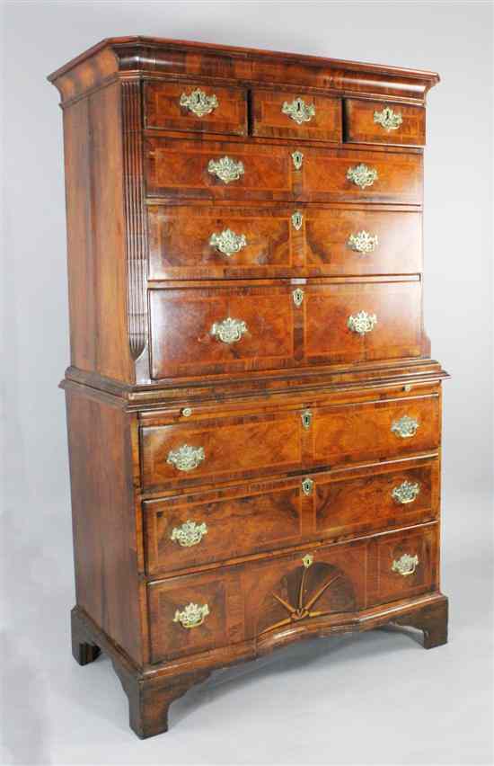 Appraisal: An early th century crossbanded walnut chest on chest with