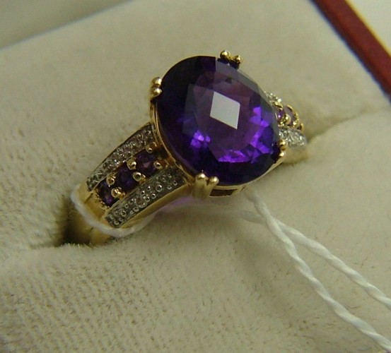 Appraisal: AMETHYST AND DIAMOND RING K yellow gold wet with an