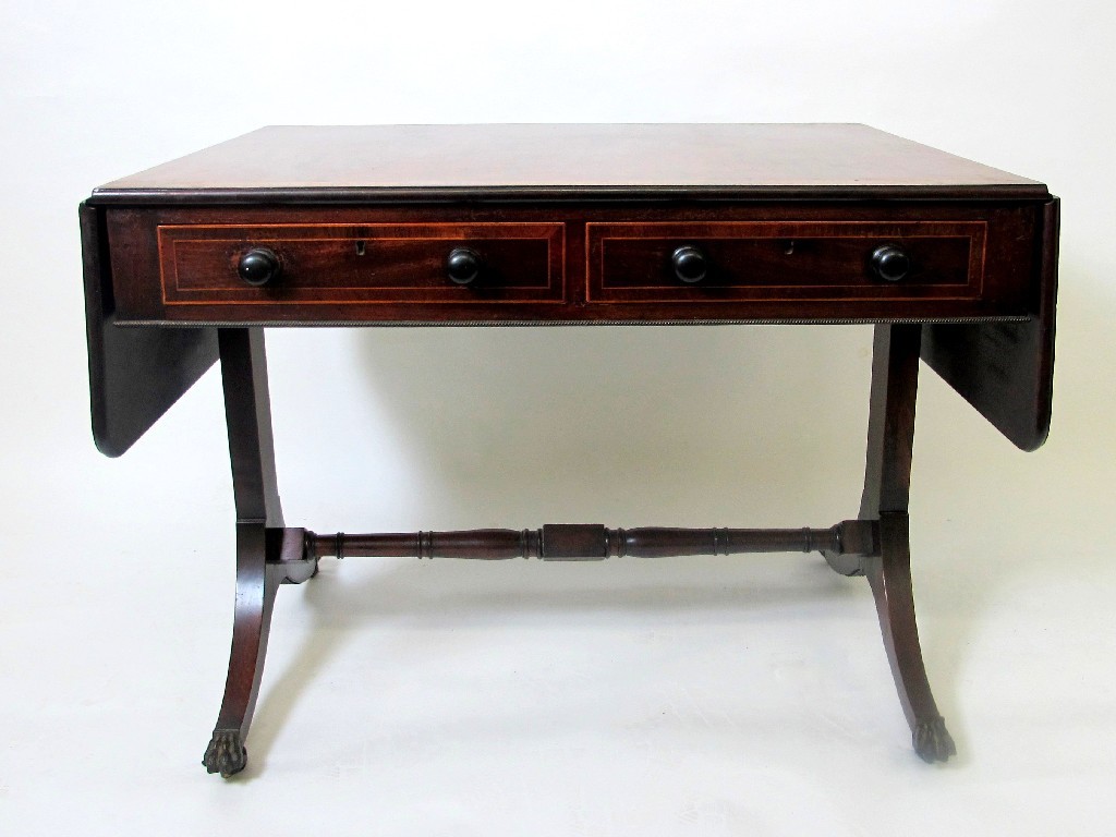 Appraisal: An Edwardian mahogany inlaid sofa table in the Regency manner