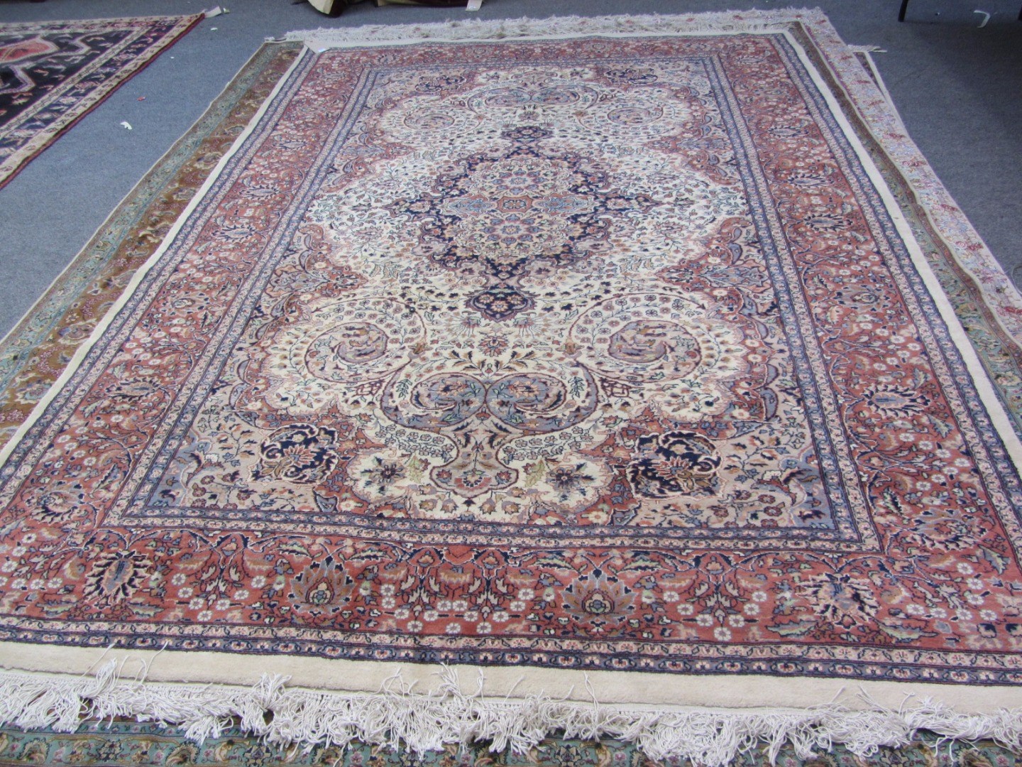 Appraisal: An Indian carpet the ivory field with a fawn and