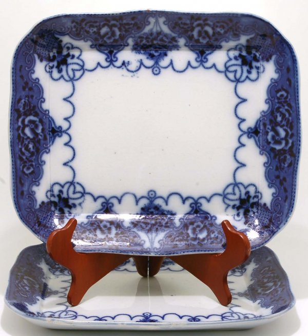 Appraisal: Two Lonsdale Flow Blue rectangular platters Violet bunches and hanging