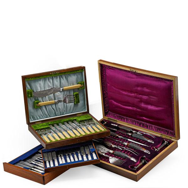 Appraisal: CASED ORNAMENTAL CUTLERY SETS Elaborate eleven piece set with bone