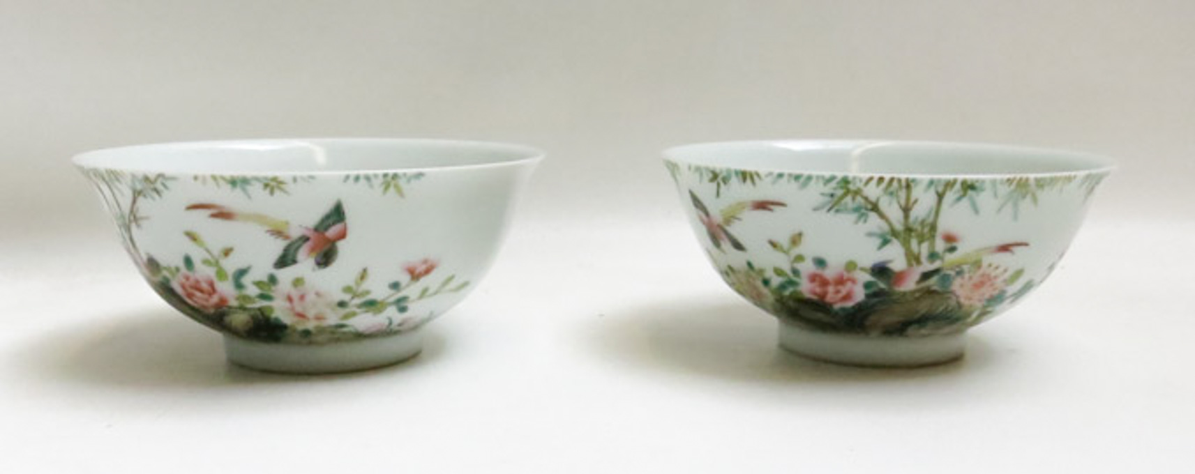 Appraisal: A PAIR OF CHINESE ENAMELED PORCELAIN BOWLS the sides decorated