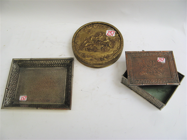 Appraisal: THREE METAL DRESSER ITEMS Apollo round trinket box putti among