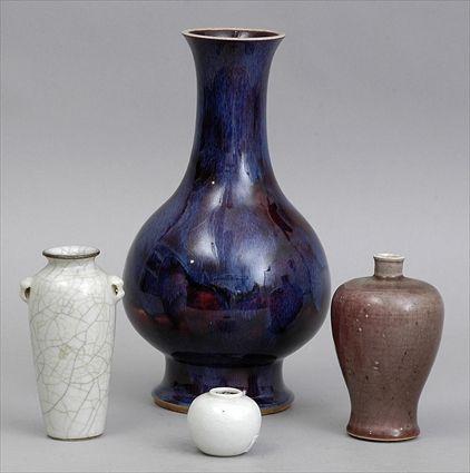 Appraisal: THREE CHINESE PORCELAIN VASES AND A JARLET Comprising an aubergine-glazed