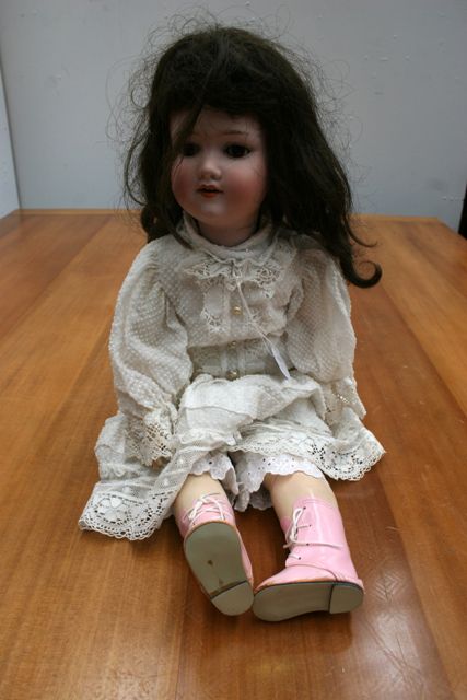 Appraisal: An Armand Marseille bisque head child doll with sleeping brown