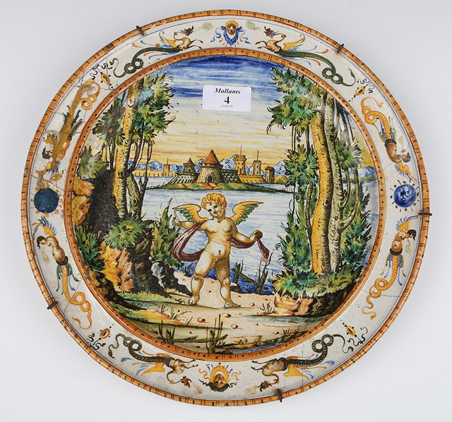 Appraisal: AN OLD MAIOLICA POLYCHROME POTTERY DISH decorated a central winged