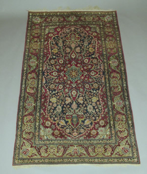 Appraisal: A Tabriz rug with star centred pole medallion in blue