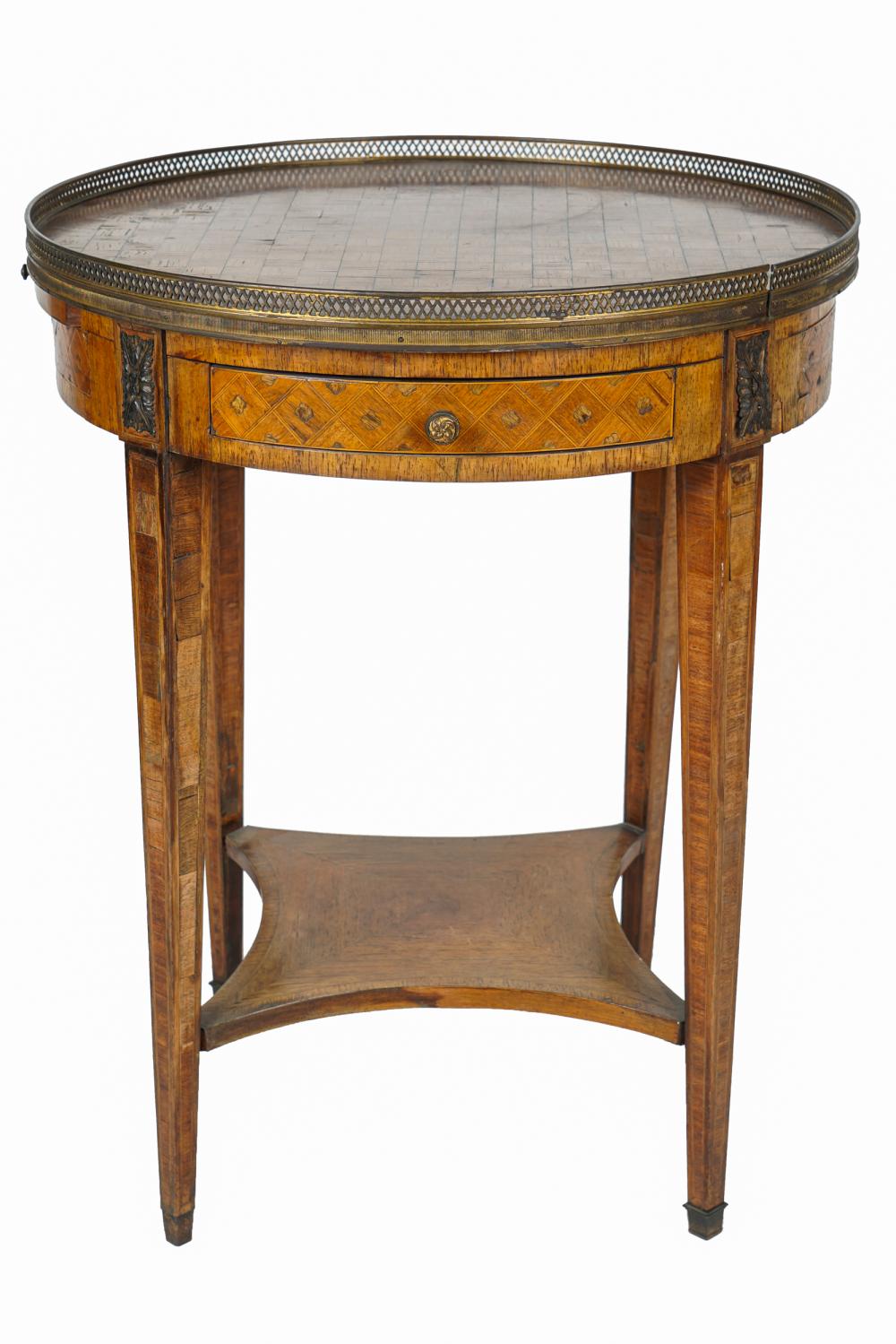 Appraisal: FRENCH PARQUETRY GUERIDONthe circular top with pierced gallery over two