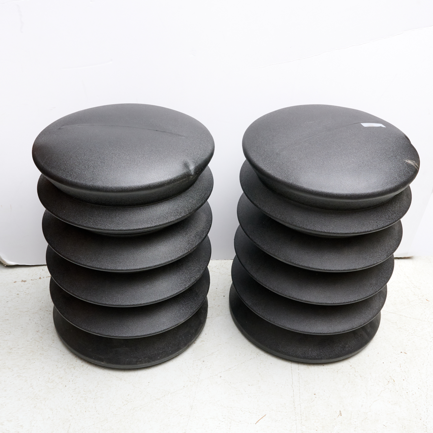 Appraisal: PAIR ALAN HELLER ERGOERGO SEAT STOOLS st c pair black