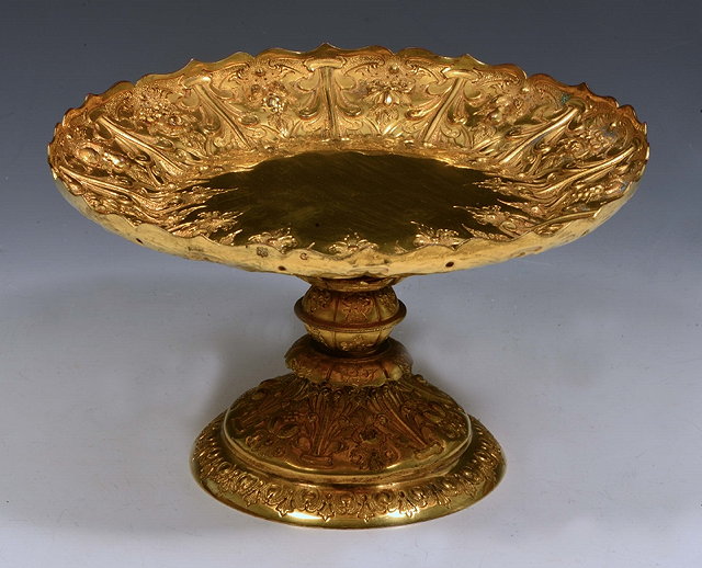 Appraisal: AN ITALIANATE GILT METAL TAZZA with pressed foliate decoration on