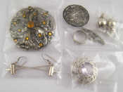 Appraisal: A mixed lot including a pair of silver earrings designed