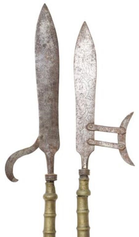 Appraisal: DECORATIVE HALBERDS POLEARMS pair Decorative halberds polearms with steel ends