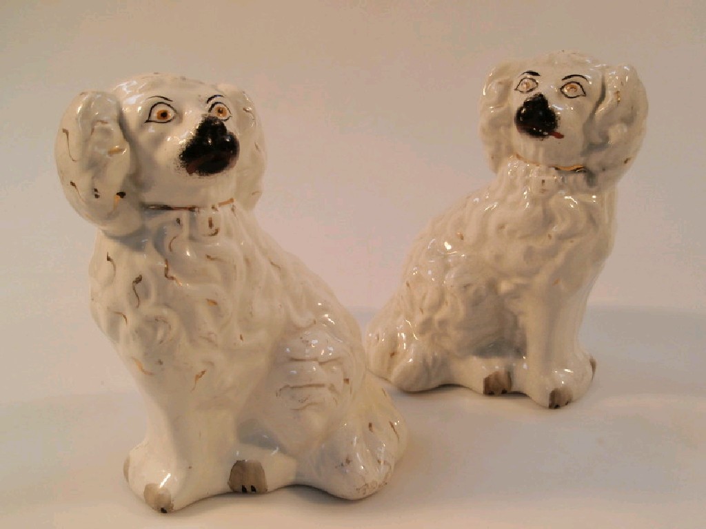 Appraisal: A pair of thC Staffordshire pottery dogs painted eyes and