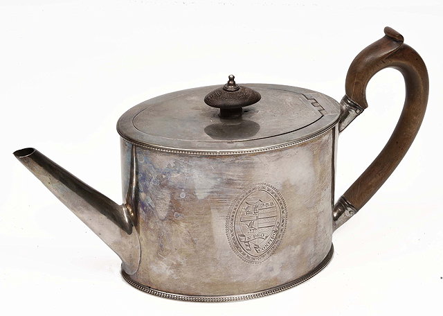 Appraisal: A GEORGE III OVAL SILVER TEAPOT with tapering spout beaded