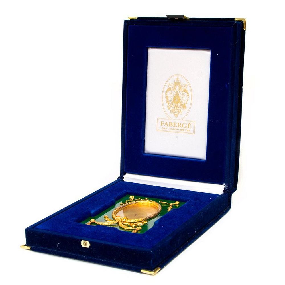 Appraisal: A Faberge frame with box A Faberge gilt metal and