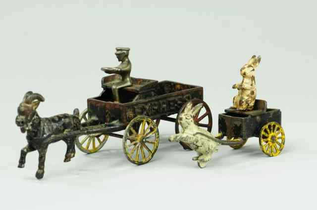 Appraisal: LOT OF TWO ANIMAL DRAWN CARTS Both cast iron include