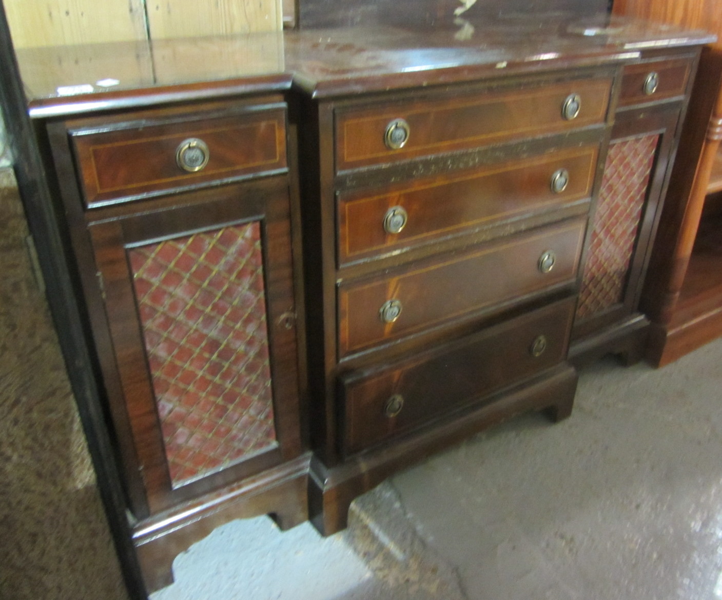 Appraisal: A th century mahogany breakfront side cabinet with drawers and